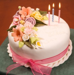 A cake embellished with flowers.
