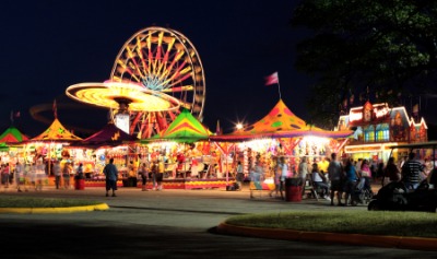 A fairground at night.